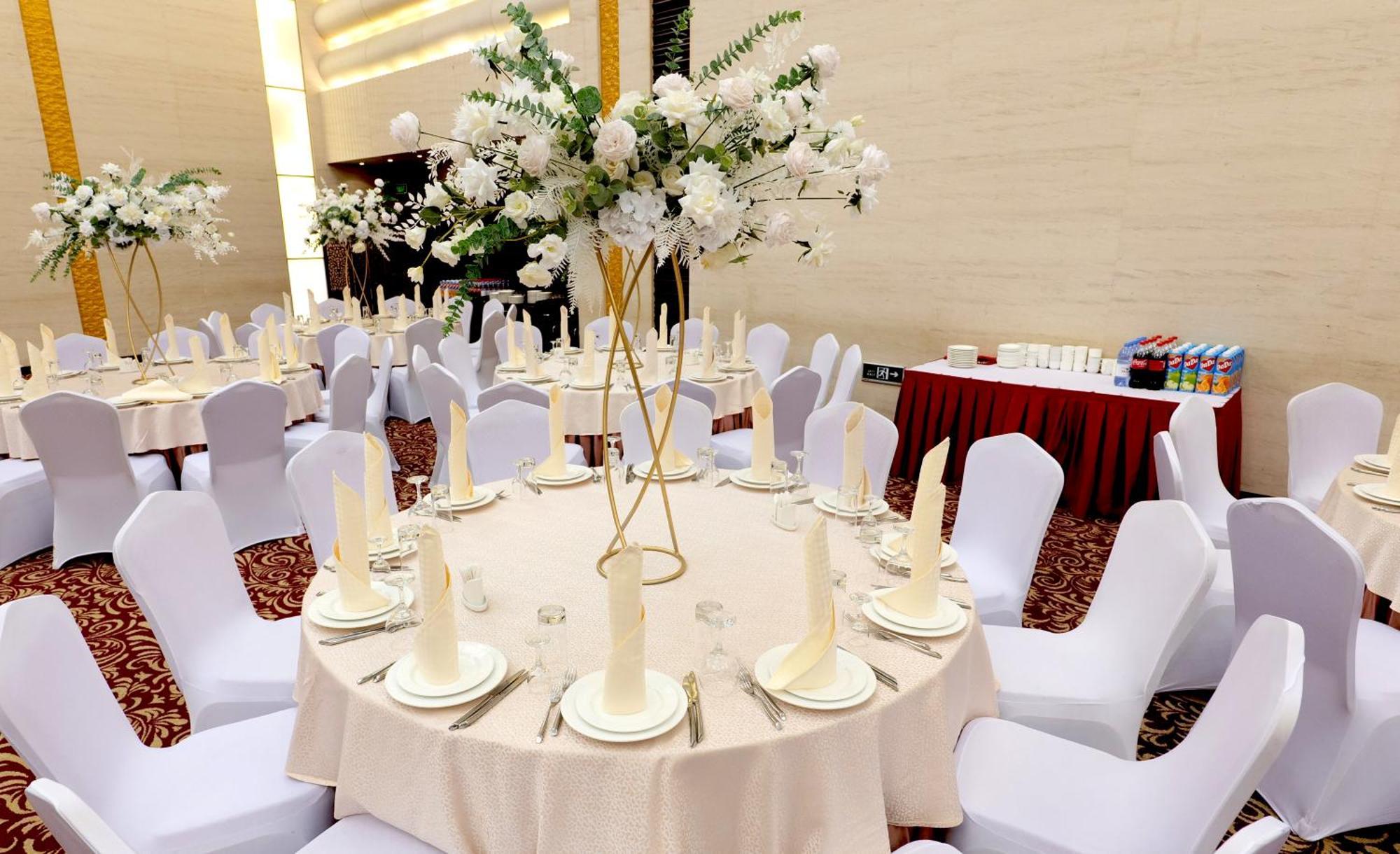 Beijing Palace Soluxe Hotel Astana Exteriör bild A table set for a formal dinner
